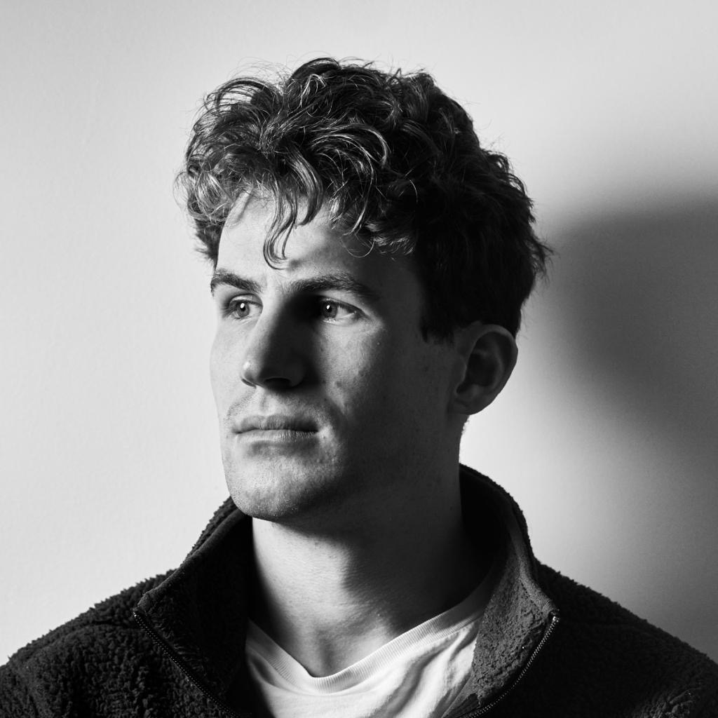 Black and white portrait of a young man in side light